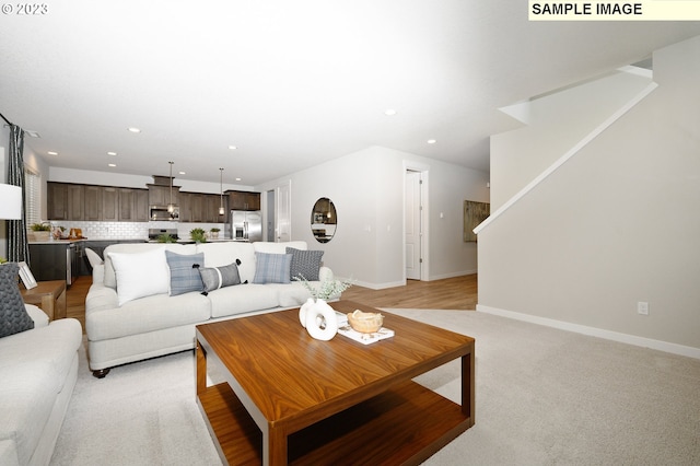 living room featuring light colored carpet