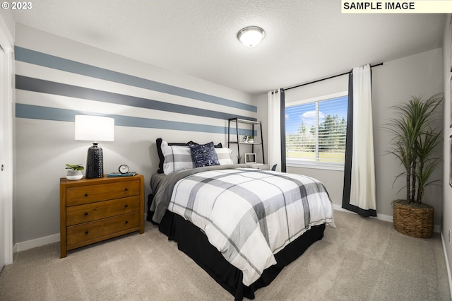 carpeted bedroom featuring a textured ceiling