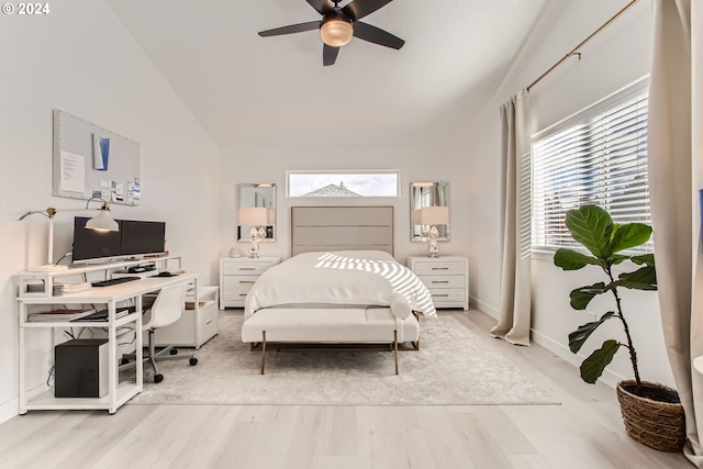 bedroom featuring lofted ceiling, light hardwood / wood-style flooring, and ceiling fan