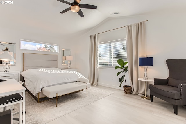 bedroom with lofted ceiling, light hardwood / wood-style floors, and ceiling fan