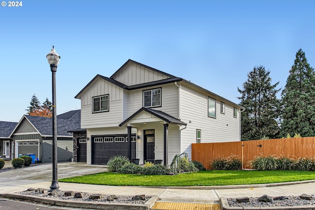 view of front facade with a front yard and a garage