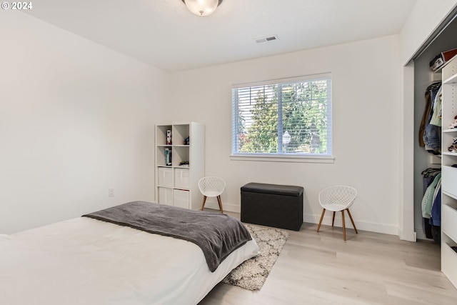 bedroom with light wood-type flooring