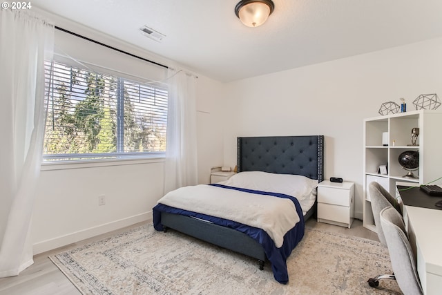 bedroom featuring light wood-type flooring