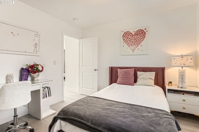 bedroom with light hardwood / wood-style floors