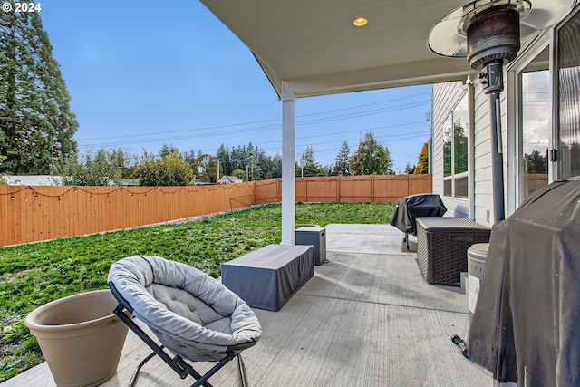 view of patio featuring a grill