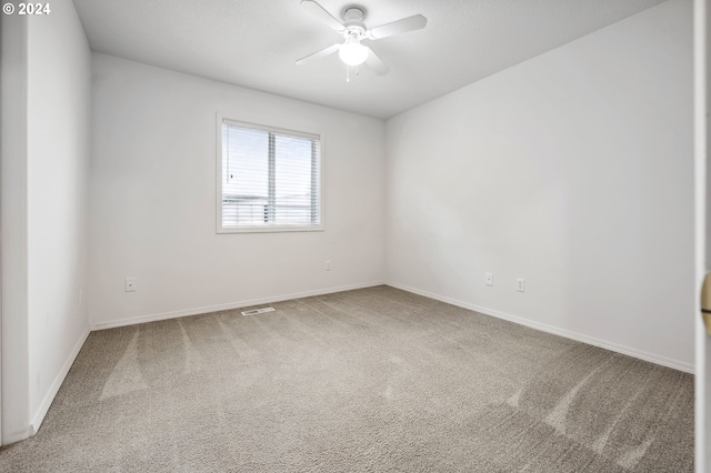 unfurnished room featuring carpet floors and ceiling fan