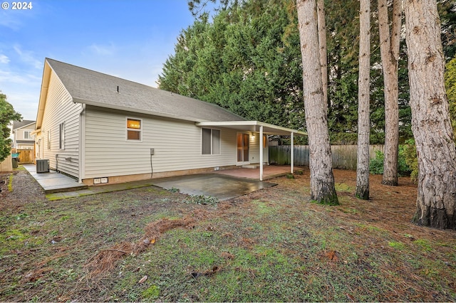 back of house with central AC and a patio area