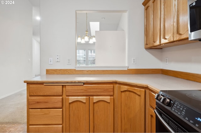 kitchen with electric range, light colored carpet, a chandelier, and pendant lighting