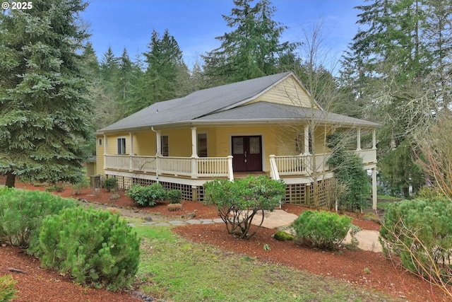 country-style home featuring covered porch and french doors