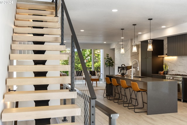 interior space with sink and light hardwood / wood-style flooring