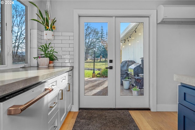 33020 S Dickey Prairie Rd, Molalla, OR 97038 - entryway with a wall unit AC and light wood-style flooring