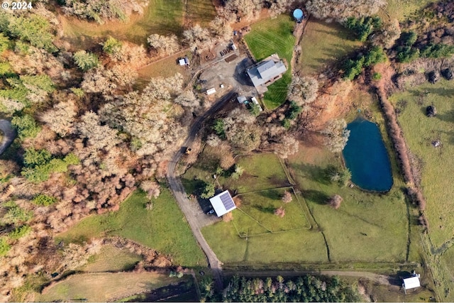 birds eye view of property featuring a rural view and a water view