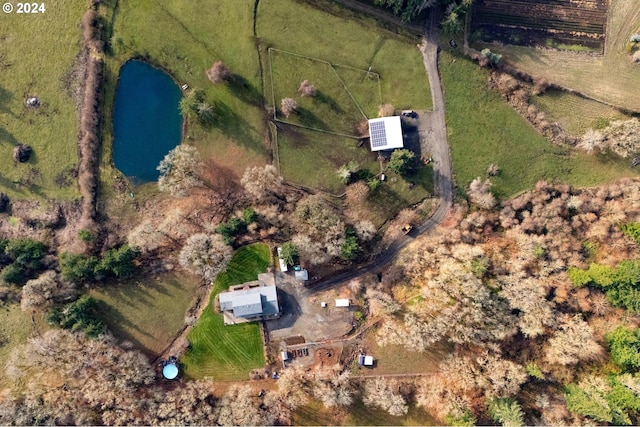 aerial view featuring a rural view and a water view