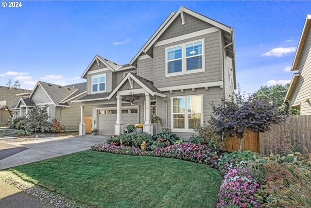 view of front of house featuring a front yard and a garage