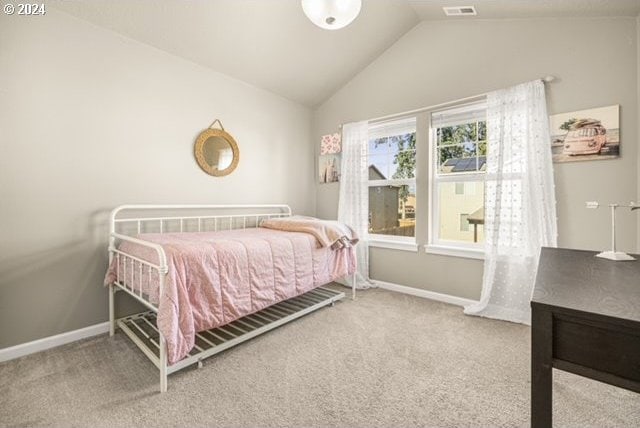 bedroom with carpet and lofted ceiling