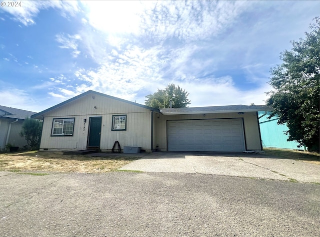 ranch-style house featuring a garage