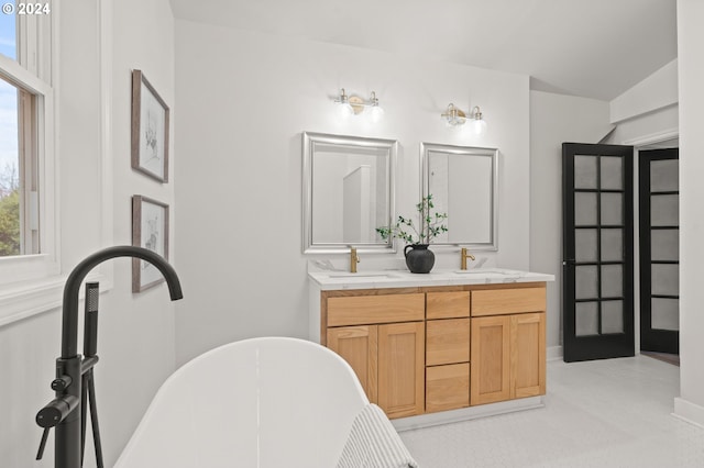 bathroom featuring vanity and a bathtub