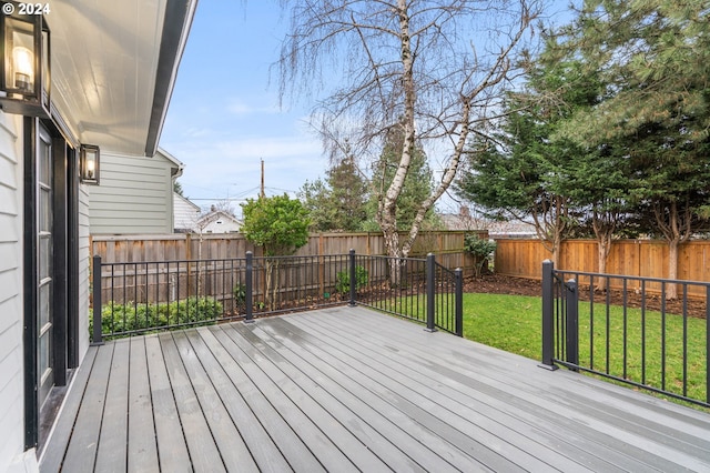 wooden terrace with a yard