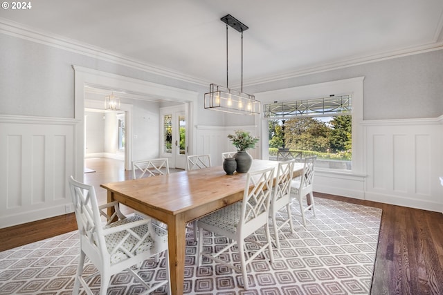 dining space featuring a wealth of natural light, wainscoting, and wood finished floors