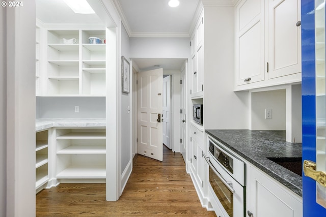 kitchen with wall oven, white cabinetry, dark wood finished floors, and open shelves