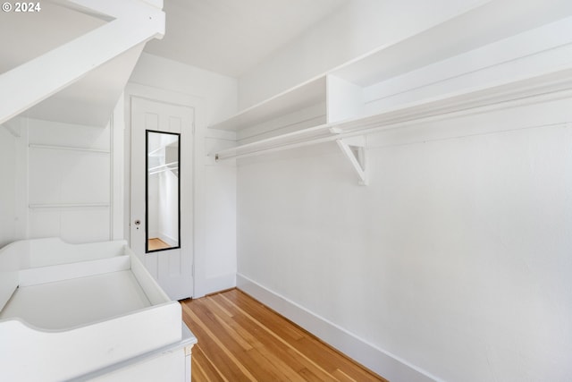 spacious closet featuring light wood-style floors