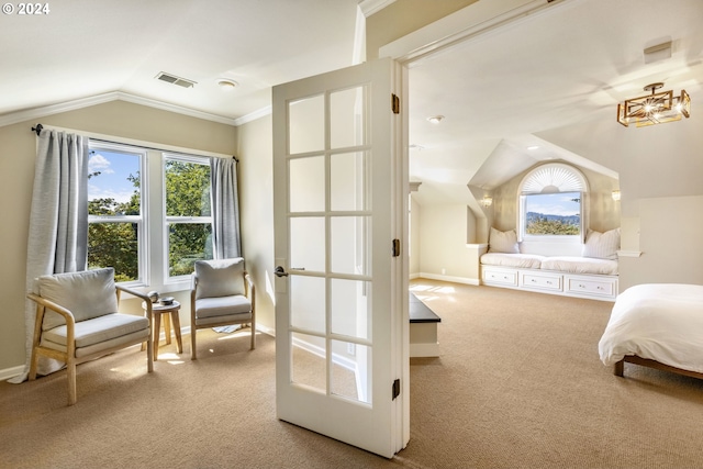 carpeted bedroom featuring vaulted ceiling, ornamental molding, visible vents, and baseboards