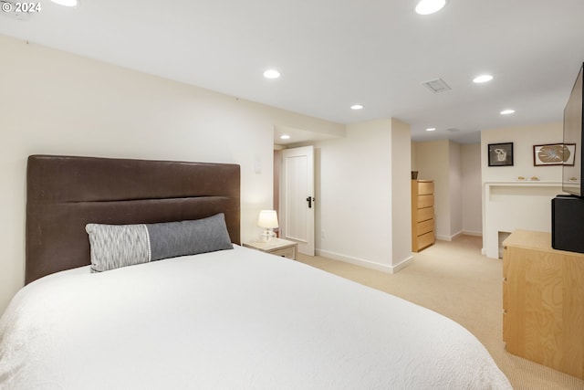 bedroom featuring recessed lighting, light carpet, visible vents, and baseboards