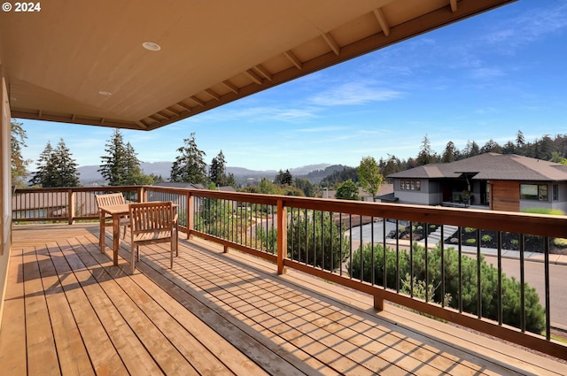 wooden terrace featuring a mountain view