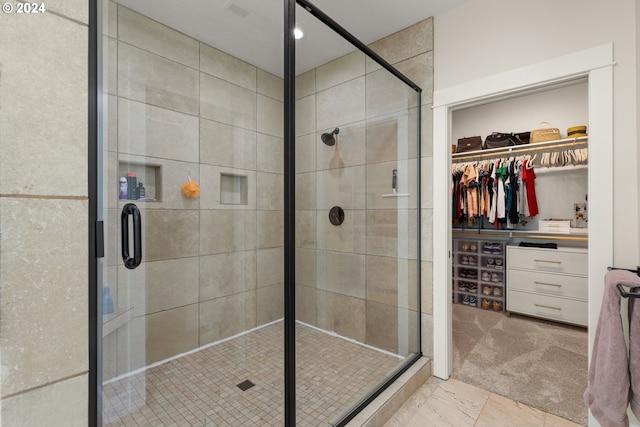 walk in closet featuring carpet flooring