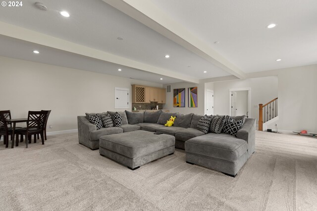 sitting room with ornamental molding and wood-type flooring