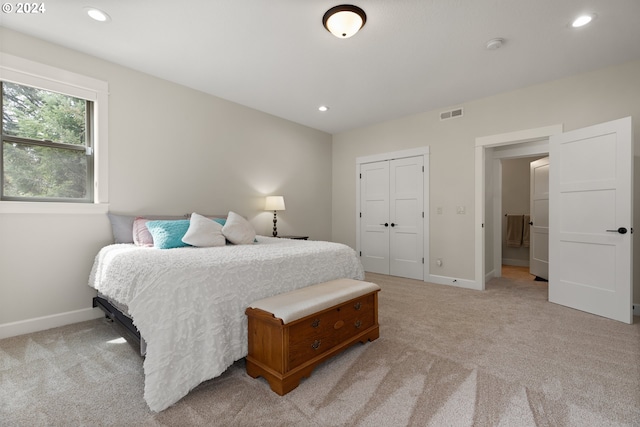 carpeted living room featuring beamed ceiling