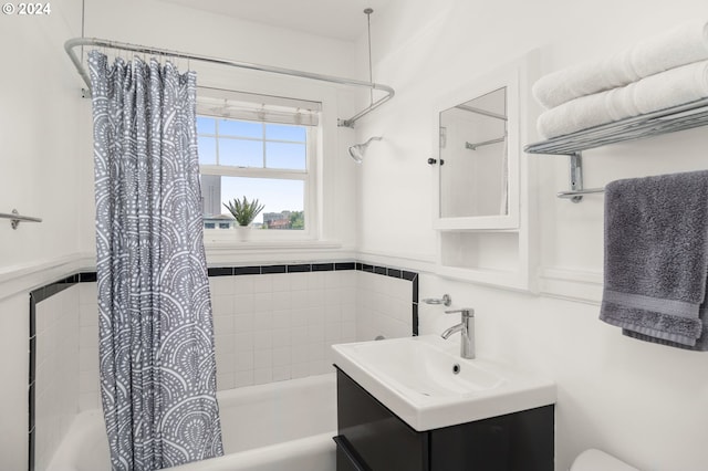 bathroom featuring vanity and shower / bath combo with shower curtain