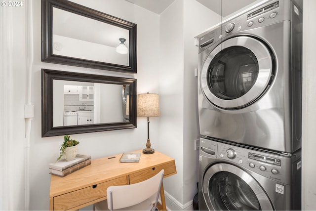 laundry area with stacked washer and clothes dryer