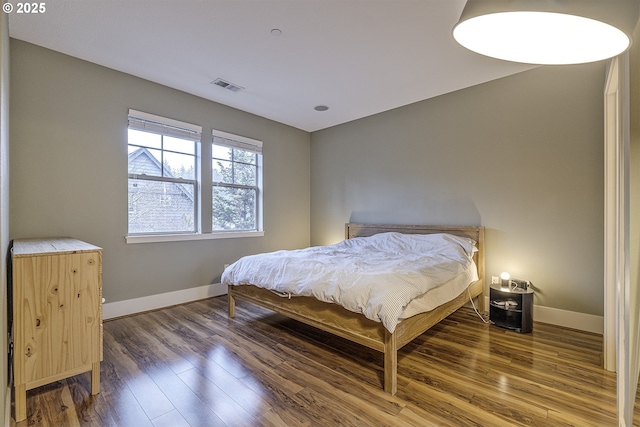 bedroom featuring dark wood-type flooring