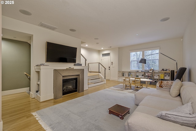 living room with light hardwood / wood-style floors