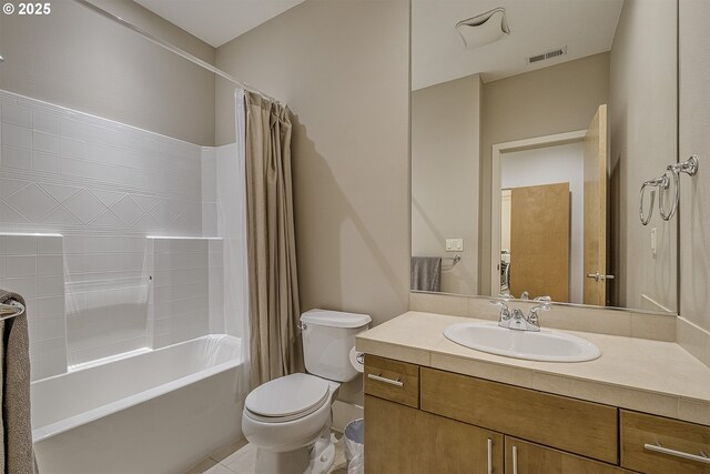 full bathroom featuring tile patterned flooring, vanity, shower / bath combo, and toilet