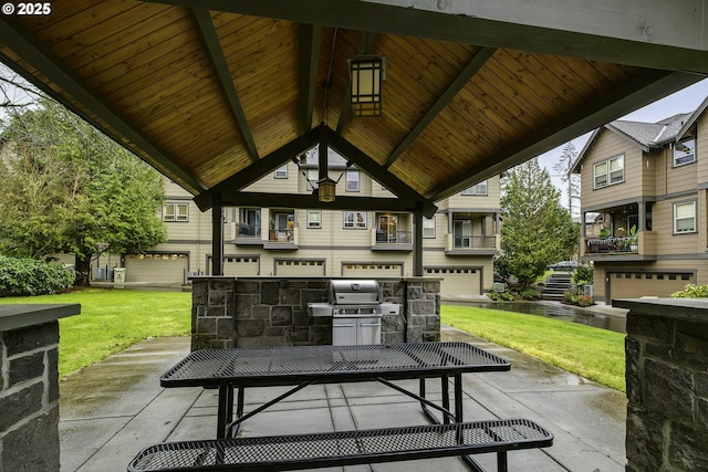 view of patio with a gazebo, a grill, and exterior kitchen