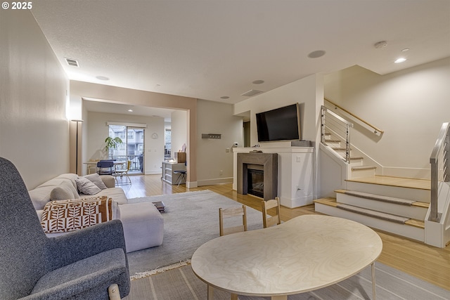 living room with light hardwood / wood-style floors