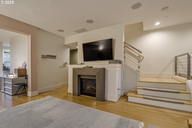 living room with light hardwood / wood-style flooring