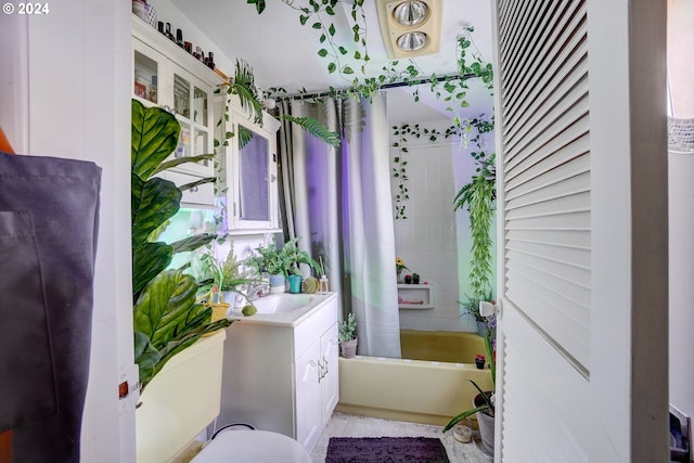 bathroom featuring vanity and shower / tub combo