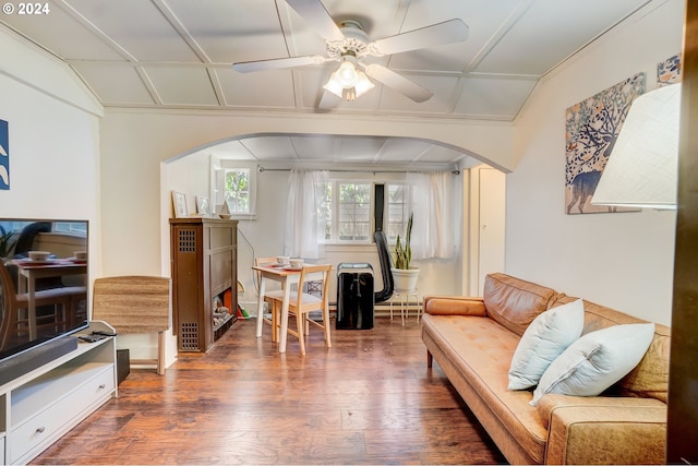 living room featuring ceiling fan, dark wood-type flooring, and vaulted ceiling