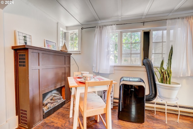 dining area with baseboard heating and dark hardwood / wood-style floors