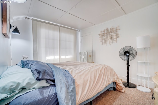 carpeted bedroom featuring ornamental molding