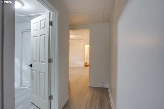 hallway with light hardwood / wood-style flooring