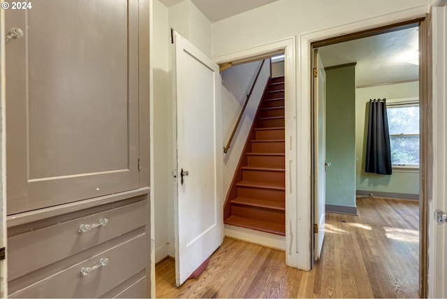 stairway featuring hardwood / wood-style flooring