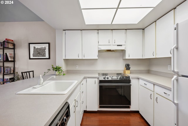 kitchen with sink, white cabinetry, range with electric stovetop, dark hardwood / wood-style floors, and white fridge