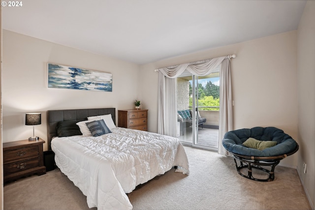 carpeted bedroom featuring access to exterior