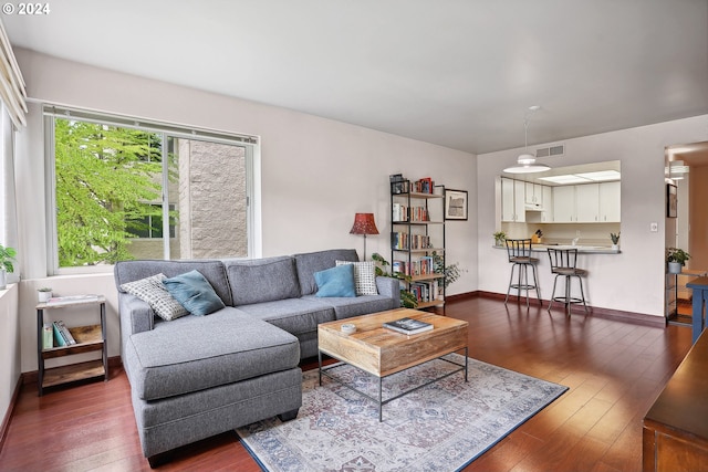 living room featuring dark hardwood / wood-style floors