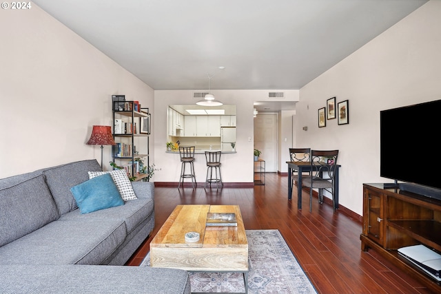 living room with dark hardwood / wood-style floors