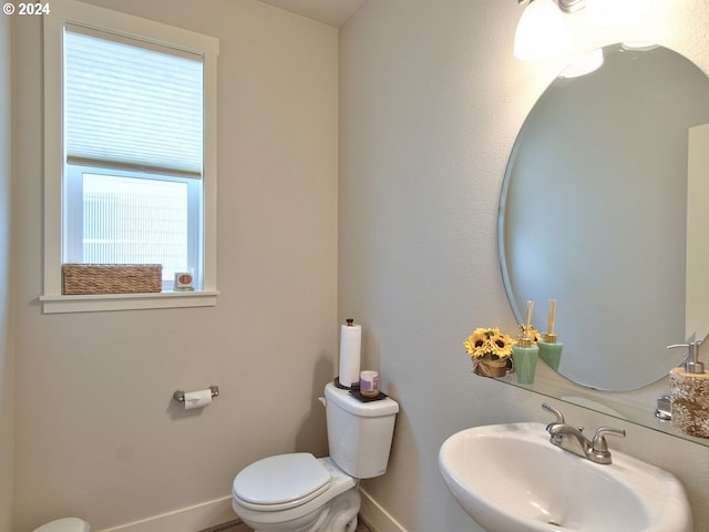 bathroom featuring sink and toilet